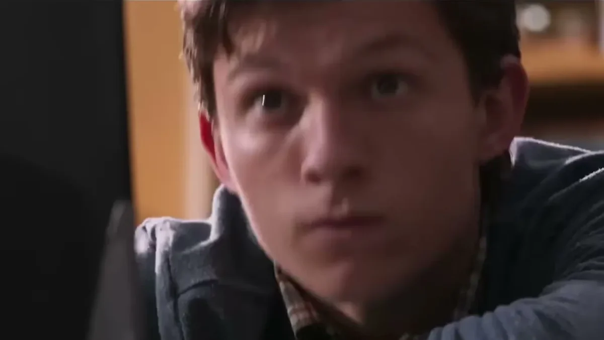 Tom Holland as Peter Parker looking up in a scene from Spider-Man: Homecoming