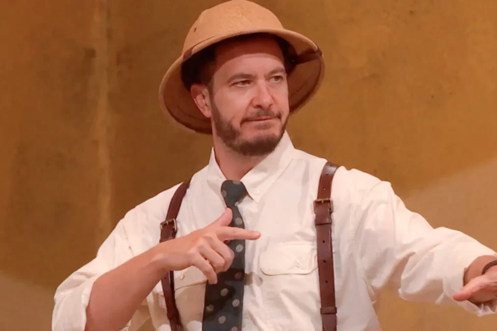 Rick Devens in a pith helmet, white shirt, suspenders and tie during an Egypt-themed Big Brother competition
