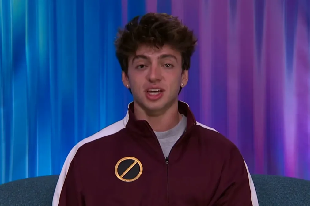 Drew Campbell in a maroon track jacket talking in the Big Brother Diary Room