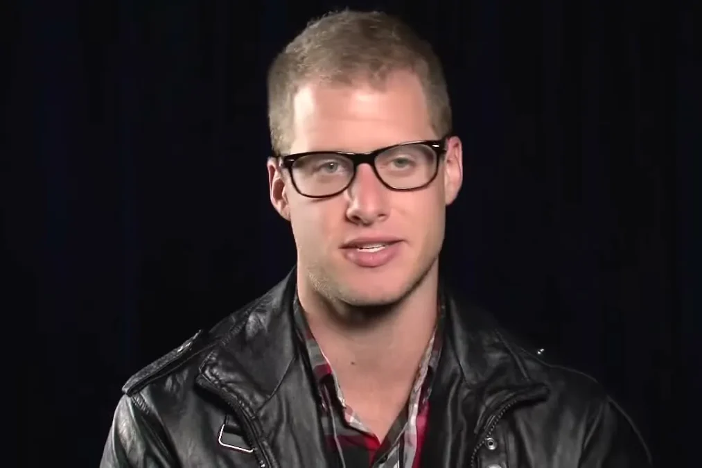 Caleb Flynn in glasses and a leather jacket during an American Idol interview in 2013