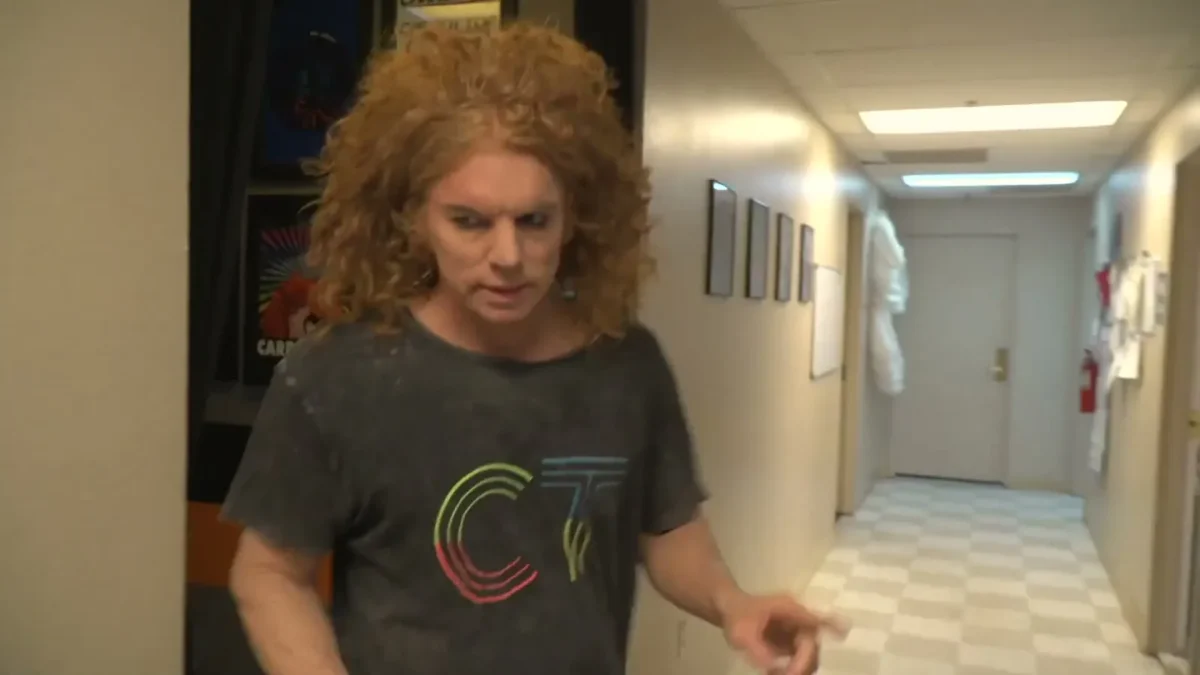 Carrot Top walking down a backstage hallway at the Luxor hotel in Las Vegas