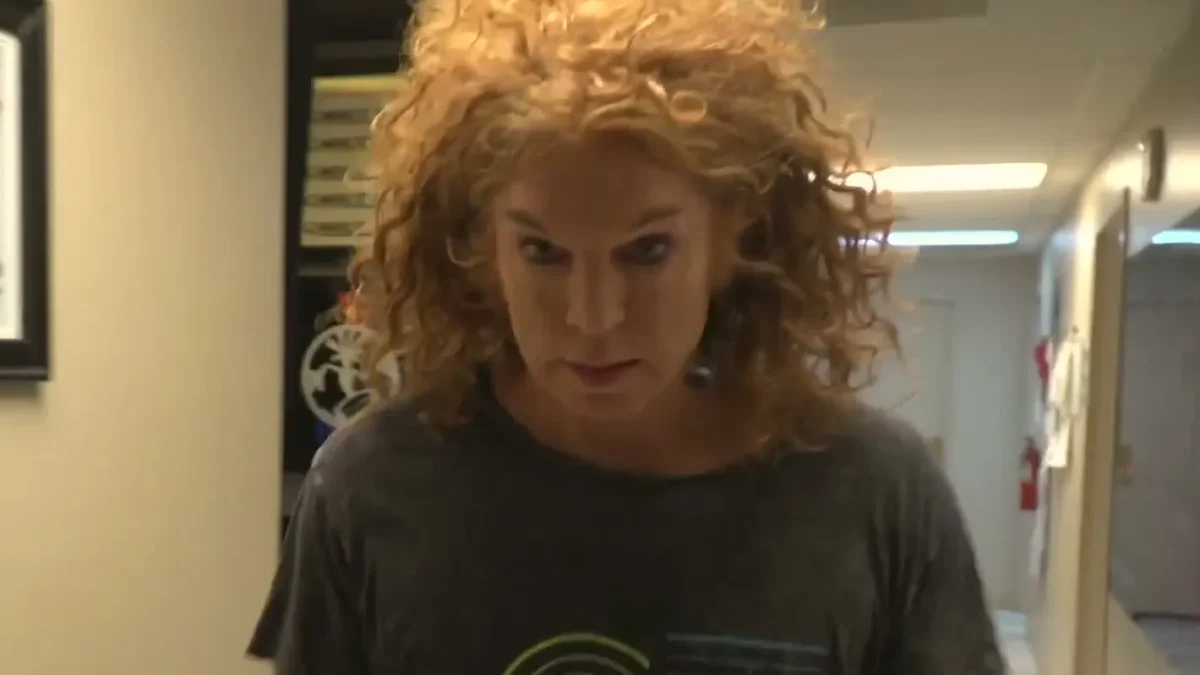 Carrot Top, in a dark CT T-shirt, walks a backstage corridor at the Luxor in Las Vegas