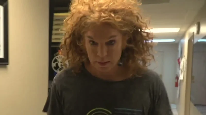Carrot Top, in a dark CT T-shirt, walks a backstage corridor at the Luxor in Las Vegas