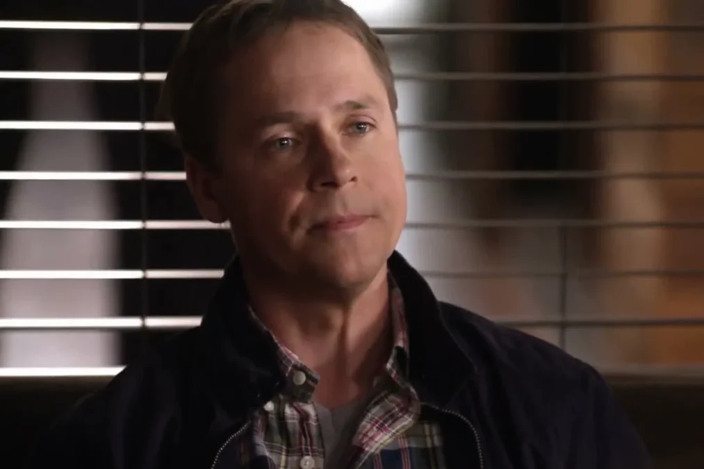 Chad Lowe in a dark jacket and plaid shirt in a scene from Drop Dead Diva