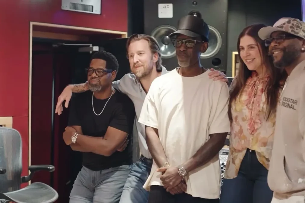 Charles Kelley with his arm around a member of Boyz II Men, posing with Hillary Scott and the R&B group in a recording studio