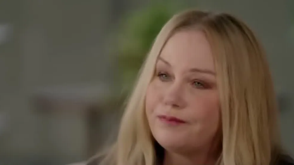 Christina Applegate listening during an interview, in close-up