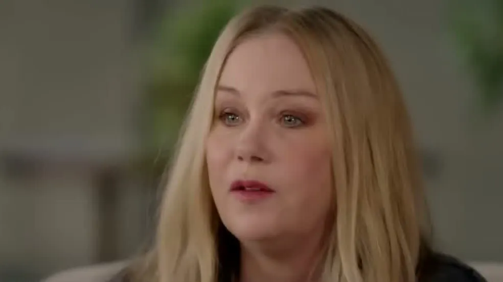 Christina Applegate, with long blonde hair, during a television interview