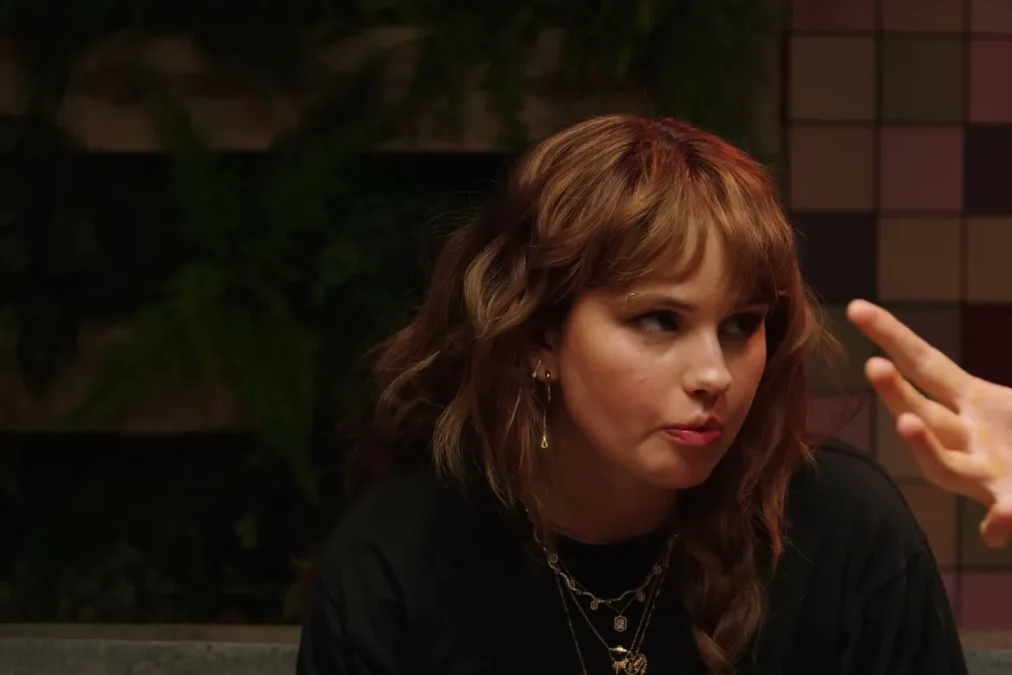 Debby Ryan gesturing as she talks on the set of Last Meals