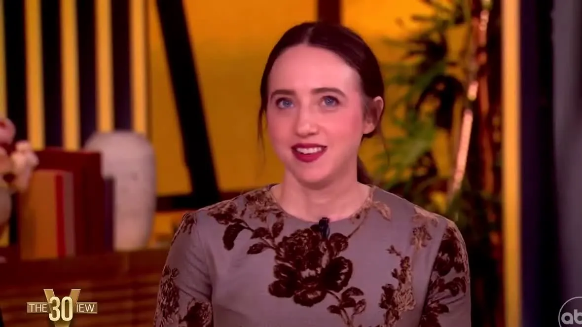 Zoe Kazan in a floral dress smiling on The View set