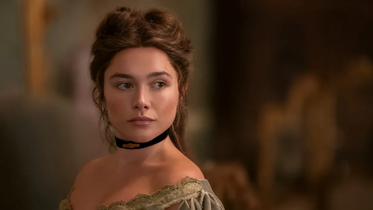 Florence Pugh as Cathy with her hair pinned up and a black choker in East of Eden