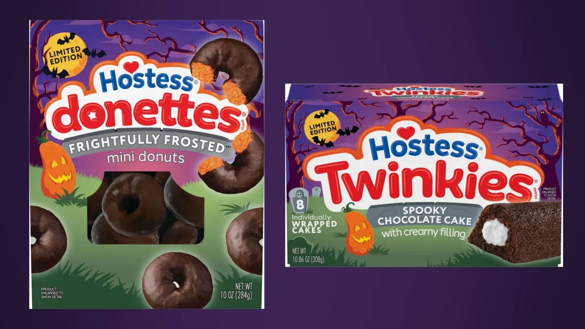 Composite image: a bag of Hostess Donettes Frightfully Frosted mini donuts, showing a bitten chocolate donut with an orange center, next to a box of Hostess Spooky Twinkies chocolate cake with creamy filling, on a dark purple background