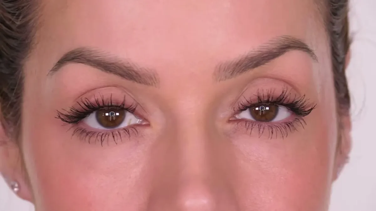 Close-up of brown eyes with long, separated lashes coated in black mascara and no smudging underneath
