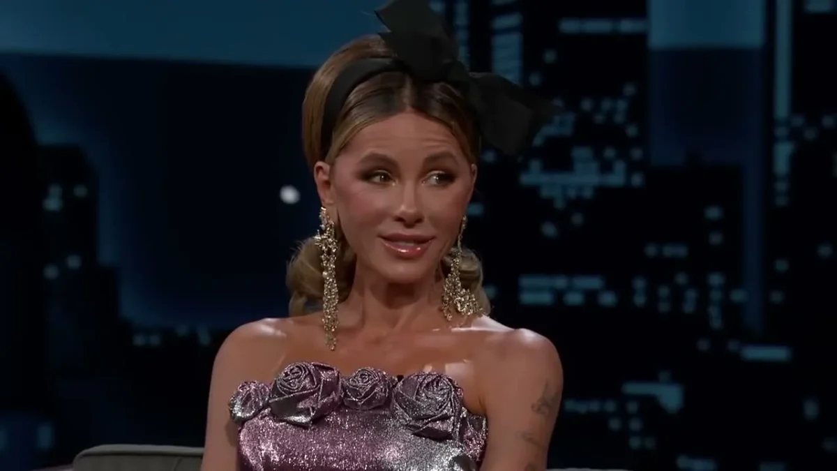 Kate Beckinsale in a lilac strapless dress and a black hair bow on the set of Jimmy Kimmel Live