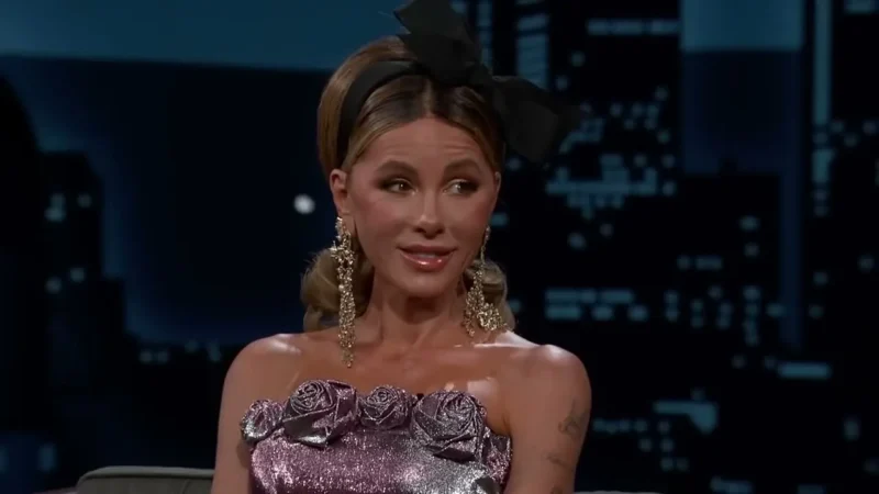 Kate Beckinsale in a lilac strapless dress and a black hair bow on the set of Jimmy Kimmel Live