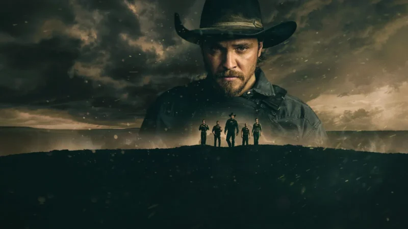 Marshals key art: Luke Grimes as Kayce Dutton in a cowboy hat under a stormy sky, with the silhouettes of five Marshals standing on a ridge below