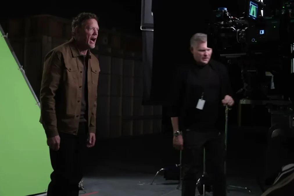 Matthew Lillard on the Scream 7 soundstage with a crew member during filming