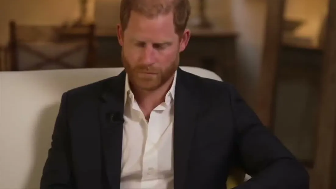 Prince Harry looking down during his BBC News interview in May 2025