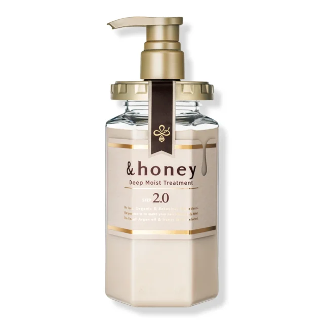 The &honey Deep Moist Treatment, Step 2.0, a cream conditioner in a white hexagonal bottle with a gold pump