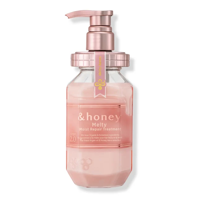 The &honey Melty Moist Repair Treatment, Step 2.0, in a pink and white hexagonal bottle with a rose-gold pump