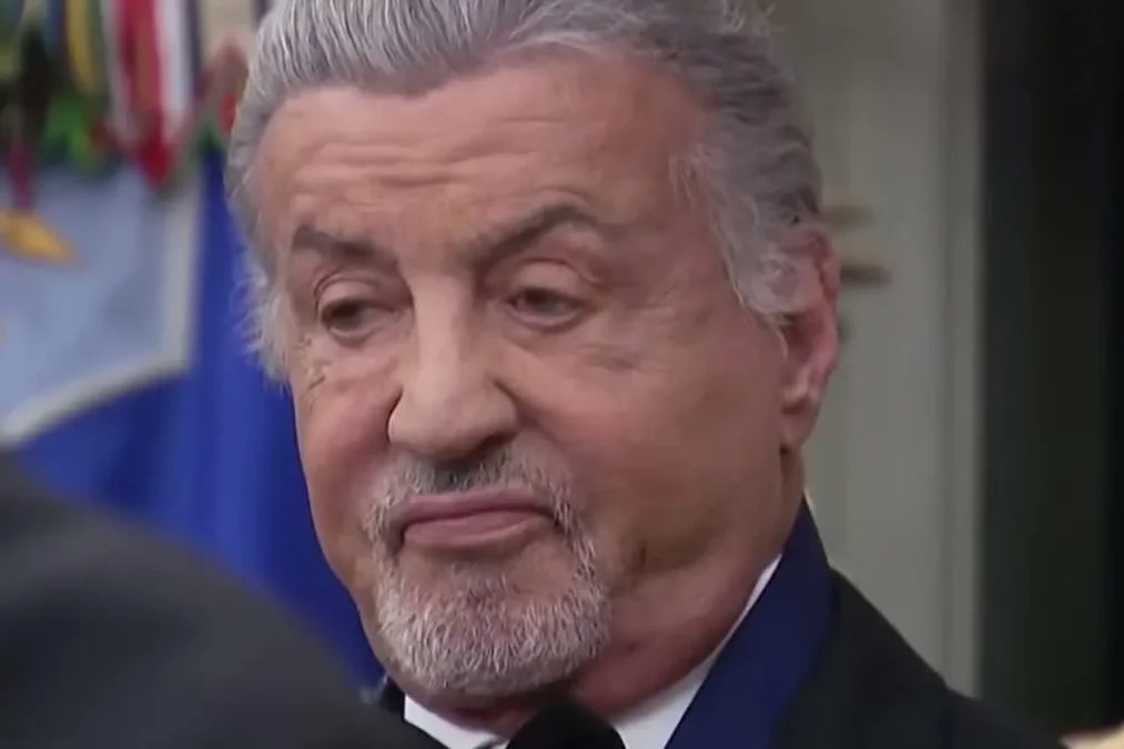 Sylvester Stallone wearing his Kennedy Center Honors medal at the White House