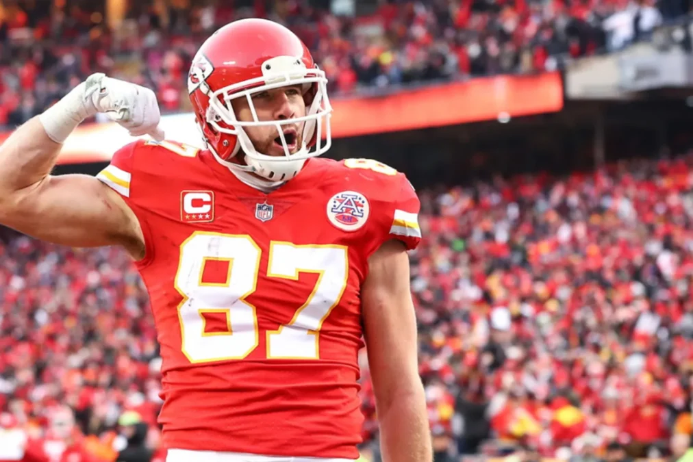 Travis Kelce celebrates in his No. 87 Kansas City Chiefs jersey at Arrowhead Stadium