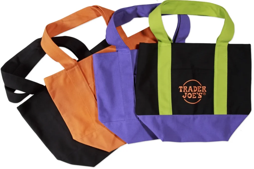 Trader Joe's Halloween mini canvas totes in black, orange, purple and black with lime green handles and a purple bottom
