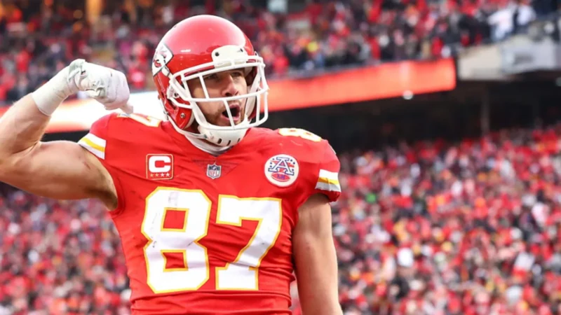 Travis Kelce celebrates in his No. 87 Kansas City Chiefs jersey at Arrowhead Stadium