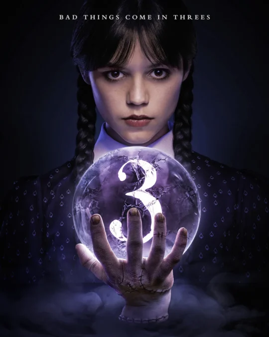 Season 3 key art of Wednesday Addams holding a crystal ball with the number 3 inside, under the line Bad things come in threes