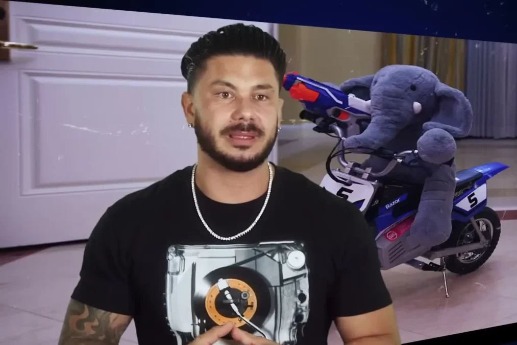 Pauly D in a black T-shirt with a turntable print, in a Jersey Shore: Family Vacation confessional