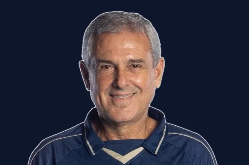 LA Orbit head coach Zé Roberto smiling in a navy polo in his official team headshot