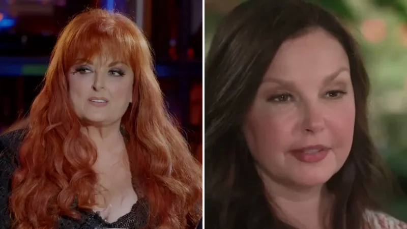 Composite image: Wynonna Judd with long red hair during a TV interview, and Ashley Judd with dark hair during a TV interview