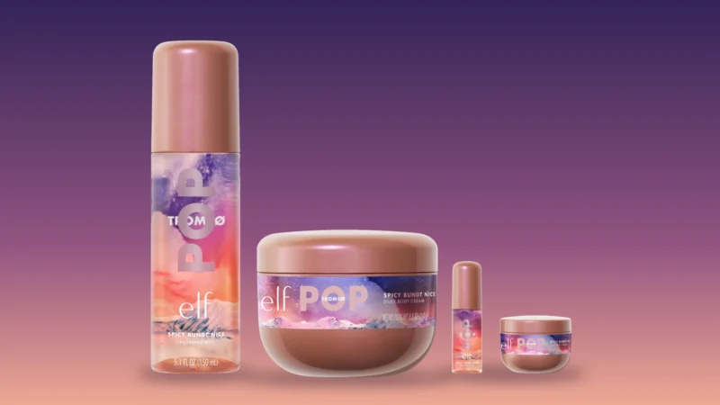 The e.l.f. POP Tromsø collection on a purple-to-coral background: the Spicy Bundt Nice fragrance mist, the silky body cream jar and the travel-size mini mist and cream