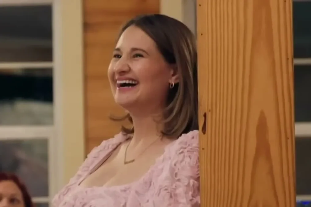 Gypsy Rose Blanchard laughing in a pink dress at her baby shower