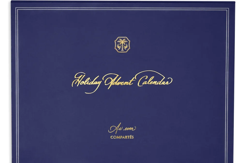 The navy blue front of the As ever Holiday Advent Calendar box with gold script and the As ever and Compartes names