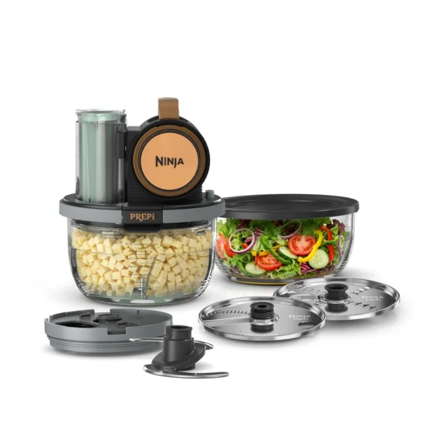 The Ninja PREPi PN351 in Copper and Teal with diced potatoes in the bowl and its dicing kit